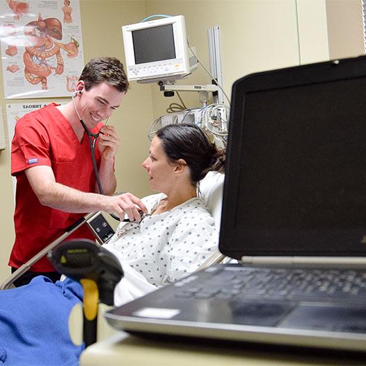 Nursing student smiling while at a clinical